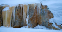 Melting spring waters soon become colorful icicles.