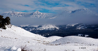 Mountains, clouds and snow along the road to Mammoth from Lamar Valley.